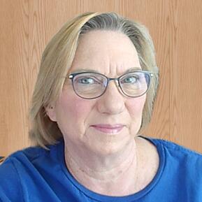 Picture of Tammy Storm with blue shirt and glasses.